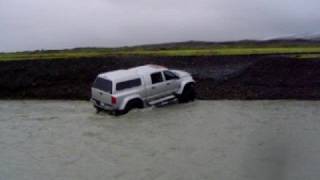 54 inch truck crossing a glacial river in Iceland