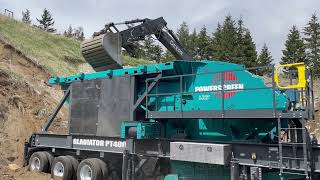 The New Powerscreen Gladiator PT400 Jaw Crusher In Action Crushing Pit Run.