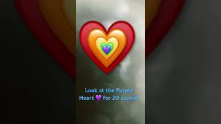 Look at the Purple Heart for 20 seconds then look at the wall