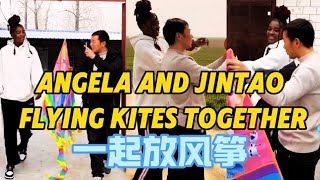 Anjina and Jin Tao fly a kite together