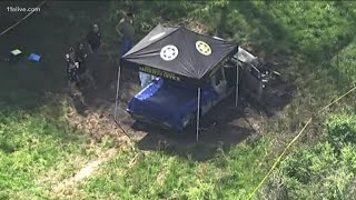 Man arrested, victims identified in discovery of two bodies in burned-out truck in Spalding County