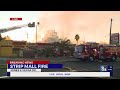 Fire crews battle large blaze at strip mall