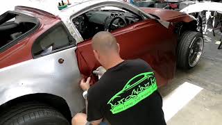 Nissan 350z Rocket Bunny Vinyl wrap by AutoSkinz Ltd. APA Satin Bordeaux red with gold striping