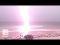 Captivating slow motion footage shows moment lightning strikes a beach | Mashable