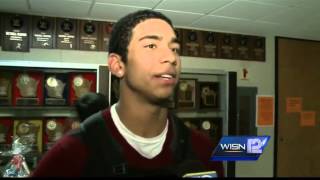 Three brothers allowed to play basketball Friday after photo dispute