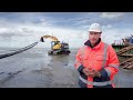 hyundai hx140lc 14 tonne excavator laying submarine cable in northern germany