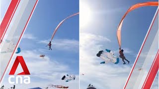 Girl lifted into the air after getting caught in kite strings at Taiwan festival