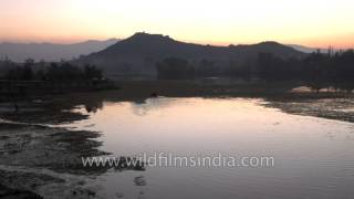 Nigeen Lake and Akbar Fort lit by the setting sun - Kashmir