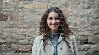 Portrait of beautiful girl waving hand outdoors smiling looking at camera