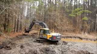 Volvo EC160CL Excavator Digging Mud