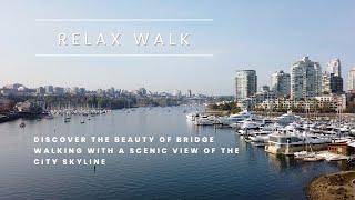 Taking a Relaxing Walk Across a Bridge: A Scenic View of the City Skyline