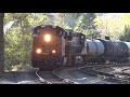 rare csx freight train hauling a dodx military caboose