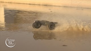 Traxxas E-REVO crossing the lake in Full speed with Paddle tires