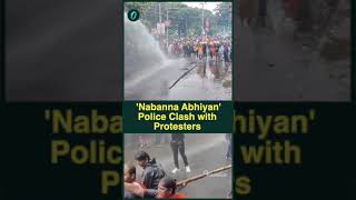 Kolkata: Security personnel lob tear gas shells in a bid to disperse protestors from Howrah Bridge