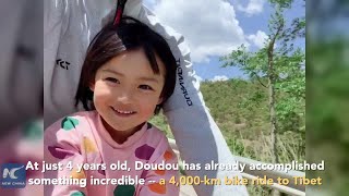 Father bikes 4,000 km to Tibet with 4-yr-old daughter