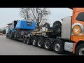 volvo fh16 750 schwertransport 5 achser mit nooteboom tieflader transportiert fuchs terex mhl 380