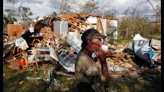 Amidst dark and debris, relief operations seek to sustain hurricane survivors