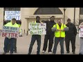 Workers protest conditions at Cuyahoga County Juvenile Justice Center using inflatable rats