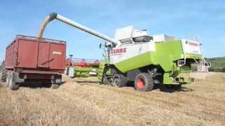 combine harvester on tracks wet country