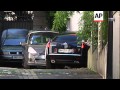 Lawyer who also faces charges arrives at Sarkozy home