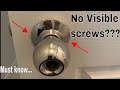 Remove door handle / knob without screws visible