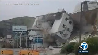 Building in Mexico collapses onto road below after reported landslide