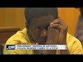 Defendant's mouthing words in court stops trial
