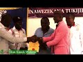 hon. enock wekesa maeni m.c.a aspirant receiving a nomination certificate fedear party