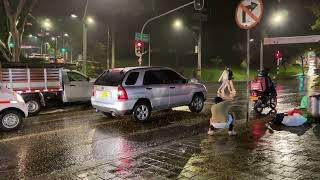 Medellin, Colombia: Poblado - walking around in famous party district in the rain, guy gets arrested