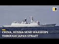 Chinese, Russian warships sail through Japan strait for first time