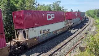 Eastbound CPKC intermodel/manifest 118 rounds the curve at mile 33.0 on July 18th, 2024.