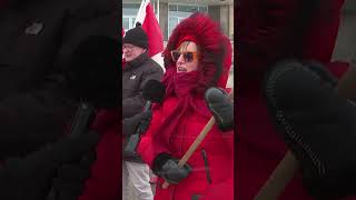 Strong winds can’t stop these Canadian Flag Day supporters