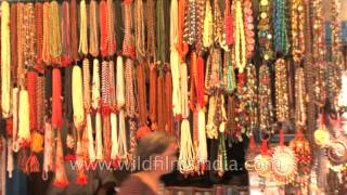 Numerous colourful prayer beads in a store at Varanasi