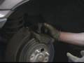 How to Replace Rear Brake Pads : Removing the Final Two Bolts from the Caliper