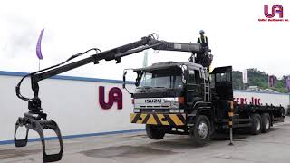 United Auctioneers Inc. - Isuzu 10w Flat Bed w/ Clamp