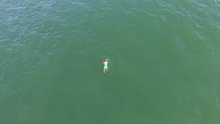 Drone video released of man swimming from Surf City Police