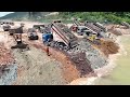 amazingly huge land reclamation bulldozer pushing rock soil truck loading capacity