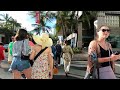 hawaii people walking on the street in beautiful waikiki hi.