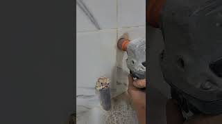 Installing the water and electricity inlet for the washing machine