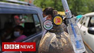 Indian temple offers drive-through oxygen amid Covid crisis - BBC News