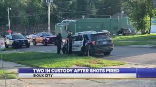 Two in custody after shots fired