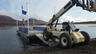 Offloading zoomboom off the barge at Smith Point