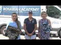 Rosarian Academy faculty deliver graduation gowns to students