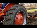 vintage farming disking with a 1955 allis chalmers b