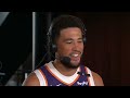 tom leander and amanda pflugrad interview with devin booker at phoenix suns media day.