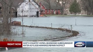 Parking lots, roads flood in northern NH