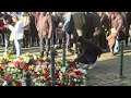 people lay flowers in german town for victims of christmas market car ramming