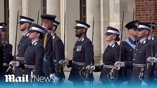 Prince William inspects officer graduates during Sovereign's Parade at Royal Air Force College