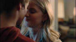 stock footage happy teenage couple first kiss girl kissing boyfriend at home after romantic evening