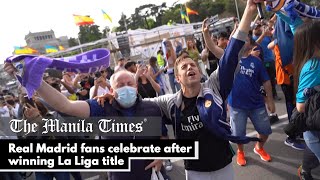 Real Madrid fans celebrate after winning La Liga title